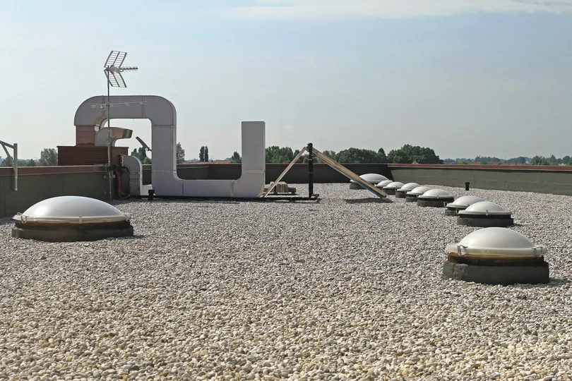 gravel layer of a built up roof system on a commercial building
